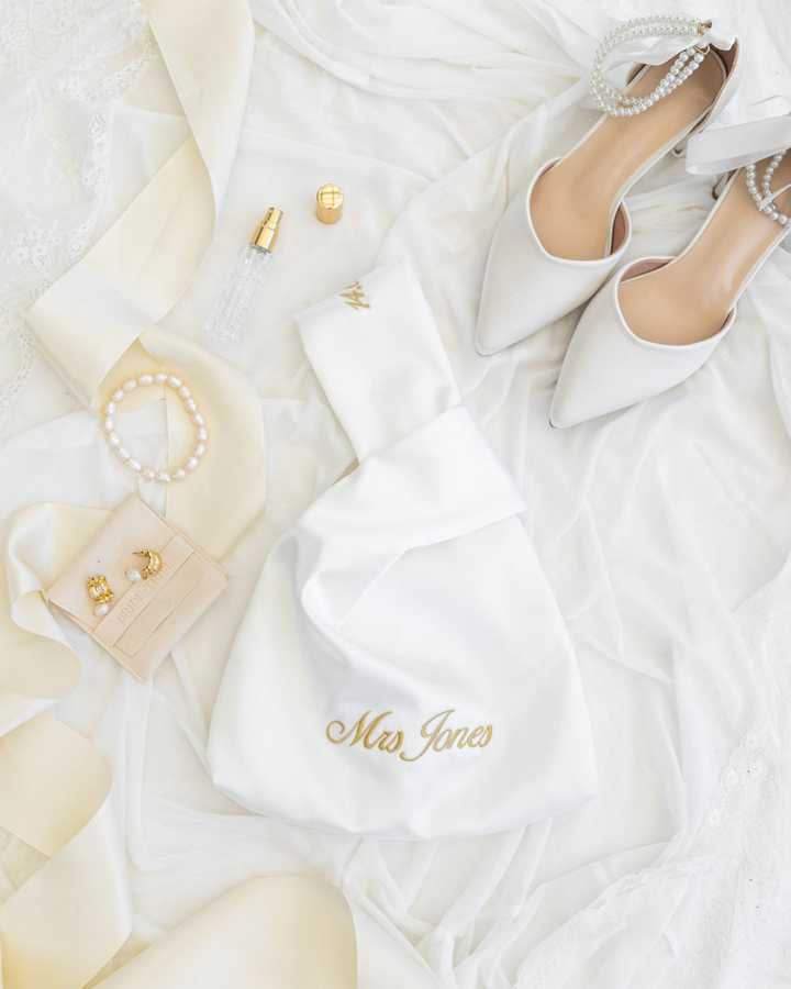 The Satin Knot Clutch