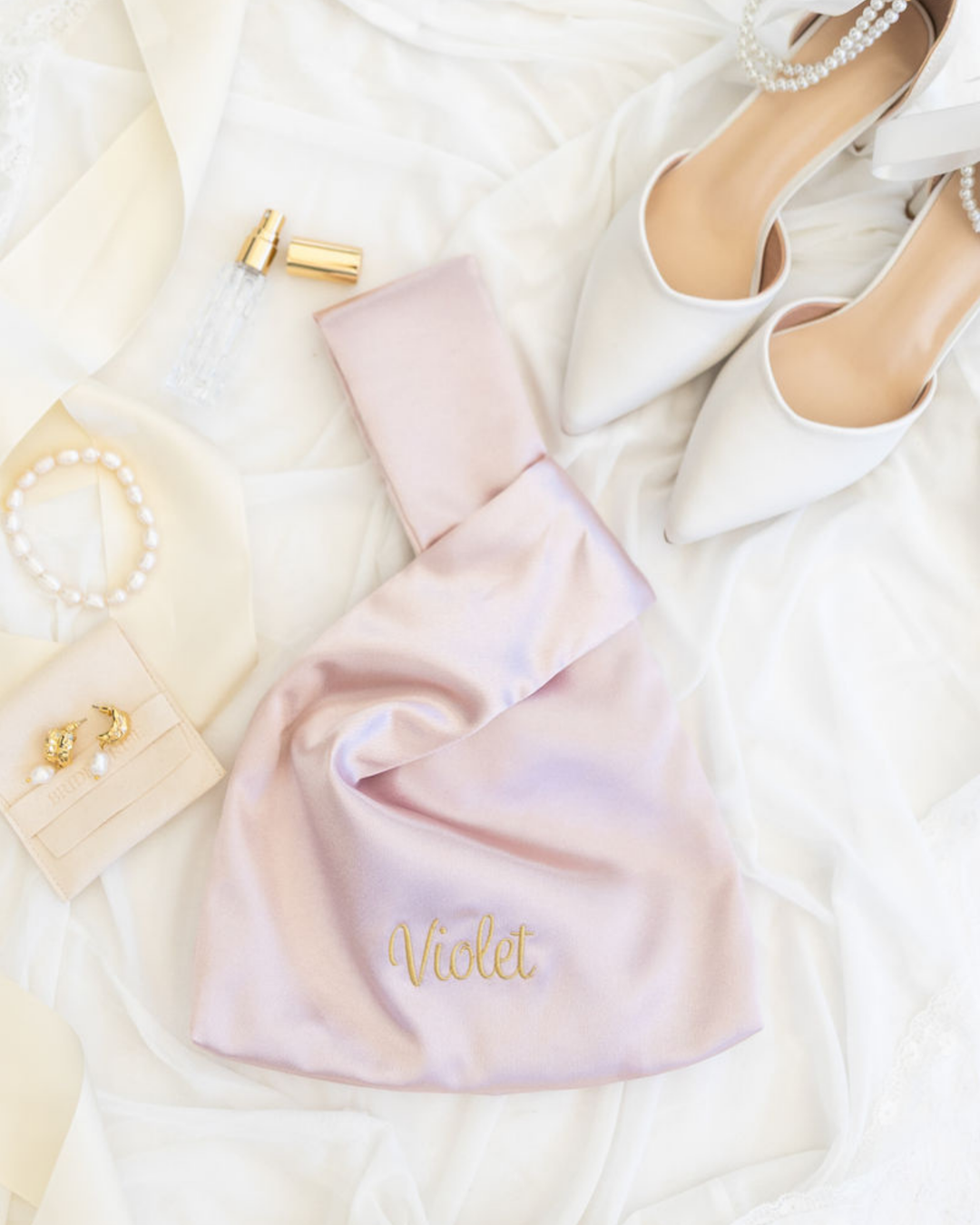 The Satin Knot Clutch