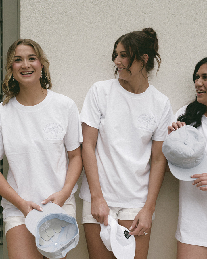 Bridal party wearing matching embroidered hens party t-shirts